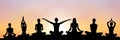 yoga group silhouette at sunset Royalty Free Stock Photo