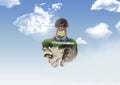 Young Girl on floating rock platform in sky playing keyboard
