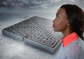 Young woman looking past maze Royalty Free Stock Photo