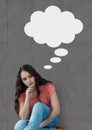 Young woman with speech bubble sitting against grey background