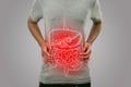 Digital composition of internal digestive system with highlighted red inflammation on sick person, man with stomach pain, health