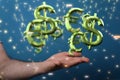 Digital concept of the dollar versus euro network, euro and dollar signs floating on the hand Royalty Free Stock Photo