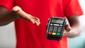 Closeup view of black man holding POS machine for payment Royalty Free Stock Photo