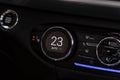 Digital control panel car air conditioner dashboard. Modern car interior conditioning buttons inside a car close up view. Royalty Free Stock Photo