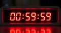 A digital countdown timer displaying 00:59:59 in red Royalty Free Stock Photo