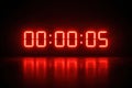 Digital Countdown Timer Showing Five Seconds Remaining in a Dark Setting With Bright Red Numerals on Display Royalty Free Stock Photo