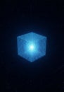 A digital cube composed of a blue wireframe grid is set against a dark background. Royalty Free Stock Photo