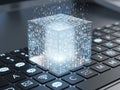 Digital cube symbolizing data integration on a laptop keyboard isolated on white background Royalty Free Stock Photo