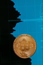 Digital Currency Bitcoin Closeup With Financial Graphics Royalty Free Stock Photo