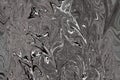 Digital Dark Grey Background With Spread Liquify Flow. Black And White Color Liquifying Pattern Royalty Free Stock Photo