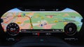 Digital dashboard of a sports car with navigation display