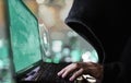 Digital data security system and protection. Anonymous hacker try to hacking on computer laptop Royalty Free Stock Photo