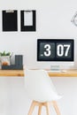 Digital clock in minimalist workspace