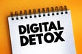 Digital Detox - period of time when a person voluntarily refrains from using digital devices, text on notepad