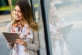 Digital device people work social media student concept. Happy young woman using digital tablet Royalty Free Stock Photo