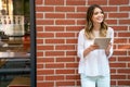 Digital device people work social media student concept. Happy young woman using digital tablet Royalty Free Stock Photo