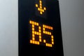 Digital display showing B five floor number inside elevator