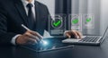 Digital document verification with tablet and laptop. Business professional approving digital files with checkmarks. Modern office Royalty Free Stock Photo