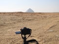 A digital DSLR camera on a tripod Photographing the Bent Pyramid of king Sneferu, A unique example of early pyramid development in