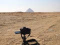 A digital DSLR camera on a tripod Photographing the Bent Pyramid of king Sneferu, A unique example of early pyramid development in