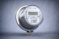 Digital electric meter with lcd screen  on grey dirty background. Electricity consumption concept Royalty Free Stock Photo