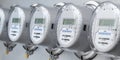 Digital electric meters in a row measuring power use. Electricity consumption concept Royalty Free Stock Photo