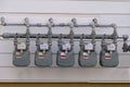 Digital electric meters in a row measuring power use Royalty Free Stock Photo