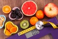 Electronic bathroom scale, centimeter with stethoscope and healthy food Royalty Free Stock Photo
