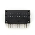 A digital electronic component featuring a black plastic housing with eight metal pins Royalty Free Stock Photo