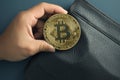 Digital finance Businessman securing bitcoin in a sleek leather wallet