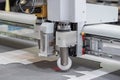 Digital flatbed cutter, plotter cutting white cardboard sheet at exhibition Royalty Free Stock Photo