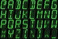 Digital font from capital letters on green alphanumeric LED display Royalty Free Stock Photo