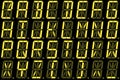 Digital font from capital letters on yellow alphanumeric LED display Royalty Free Stock Photo