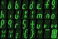 Digital font from small letters on green alphanumeric LED display Royalty Free Stock Photo