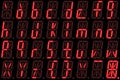 Digital font from small letters on red alphanumeric LED display Royalty Free Stock Photo