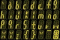 Digital font from small letters on yellow alphanumeric LED display Royalty Free Stock Photo