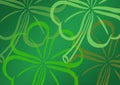 Digital generated image of shamrock designs with copy space against green background