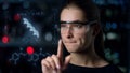 Digital glasses woman biochemist inspecting DNA hologram looking for deviations