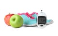 Digital glucometer, apples and sneakers