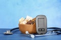 Digital glucometer, stethoscope and sweets