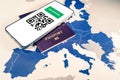 Digital green passport with QR code on a smartphone over an EU map