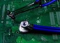 Digital health patient data storage concept - Isolated blue stethoscope on green computer circuit board Royalty Free Stock Photo