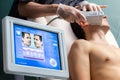 Digital hifu treatment interface with patient in background