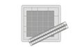 The grid a metallic ruler with metric and imperial measurements is placed Royalty Free Stock Photo