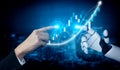 Futuristic Interaction Between Human Hand and Robotic Hand with Financial Graph in Digital Space Impute Royalty Free Stock Photo