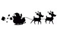 Digital image of black silhouette of santa claus and christmas gift boxes in sleigh Royalty Free Stock Photo