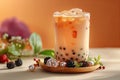 Digital image of cup of milk tea with black pearls was placed on the table in the front view. behind it was a light orange b