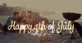 Digital image of gold Happy 4th of July greeting while background shows diverse friends laughing at Royalty Free Stock Photo