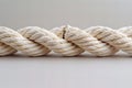 Digital image of  long white rope with two ends, one end broken off, isolated on a solid background. the cut end of the cable is Royalty Free Stock Photo