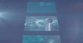 Digital image of multiple screens with data processing against spot of light on blue background Royalty Free Stock Photo